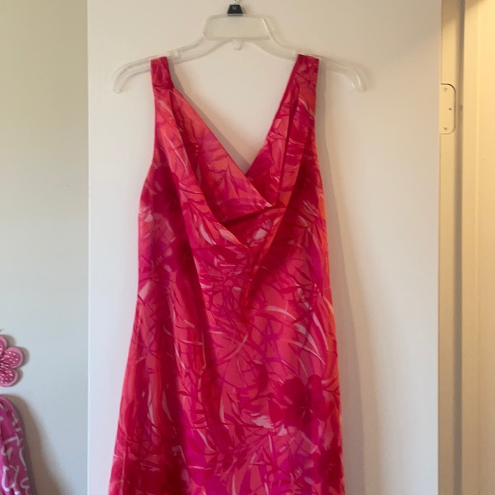 Light and airy. Asymmetrical sleeveless mid length dress.